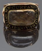 Georgian mourning ring set with plaited hair to the central glass compartment surrounded by black