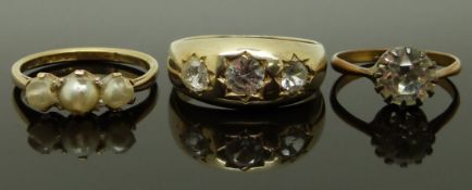 A 9ct gold ring (2.5g), a silver gilt ring set with paste and another ring, size J, N & R