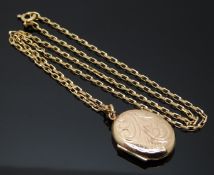 A 9ct gold locket with engraved decoration on 9ct gold chain, 6.3g