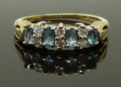 A 9ct gold ring set with aquamarines and diamonds, size L, 1.85g