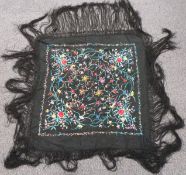 A 19th/20thC Chinese embroidered shawl with long fringe, 145 x 145cm including fringe