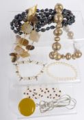 A collection of beaded necklaces including pearls