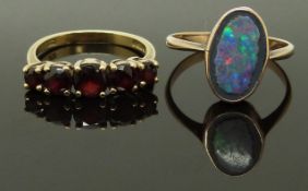 A 9ct gold ring set with garnets and another 9ct gold ring, size N & Q, 5.10g