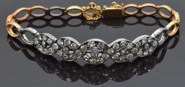 A late 19thC/ 20thC bracelet set with diamonds in a twist setting, 11.8g