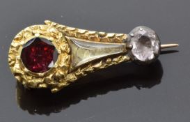 Victorian brooch in the form of Halley's comet set with a foiled garnet, foiled quartz and a glass