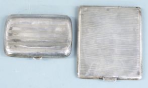 Hallmarked silver cigarette case together with a further cigarette case marked Sterling, weight