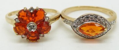 A 9ct gold ring set with pear cut Mexian fire opals and white sapphires and a 9ct gold ring set with