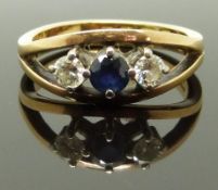 An 18ct gold ring set with a sapphire and two diamonds, each approximately 0.18ct, 5g, size N