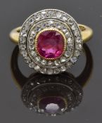 Victorian 18ct gold ring set with a cushion cut pink sapphire surrounded by two tiers of old cut