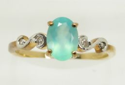 A 9ct gold ring set with an oval cut Paraiba opal and diamonds, 1.6g, size M