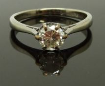 A platinum ring set with a round cut diamond of approximately 0.55ct, size K/L, 2.62g