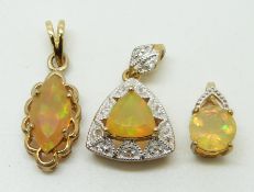 Three 9ct gold pendants set with opals