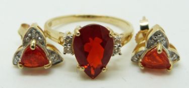 A 9ct gold ring set with a pear cut Queretaro cherry fire opal and white sapphires, and a pair of