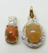 A 9ct gold pendant set with an Indonesian opal cabochon and diamonds and a 9ct gold pendant set with