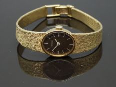 Eterna 14ct gold ladies wristwatch with white hands and baton markers, chocolate dial and signed
