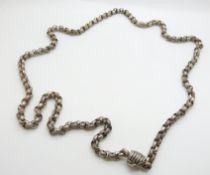 A large Victorian silver necklace made up of alternating textured and plain links, with unusual