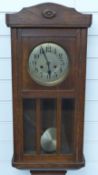 Oak cased c1910 two train wall clock with bevelled glass panels, height 78cm