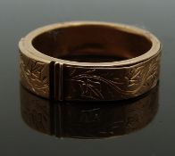 Victorian mourning ring with chased foliate decoration, opening to reveal a hollow section