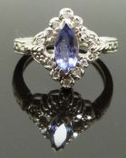 A 14ct white gold ring set with a marquise cut amethyst and diamonds, size K, 4.00g