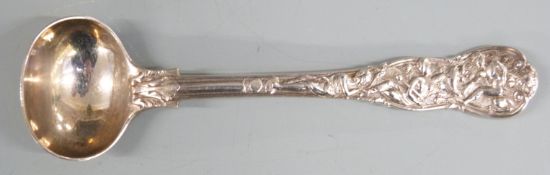 Edward VII hallmarked silver salt or mustard spoon with ornate decoration of figures and a lion,