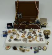 A collection of vintage and costume beaded necklaces, a collection of vintage brooches, etc