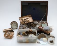 A quantity of various clock parts including new mainsprings, escape wheels, hands etc