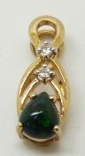 A 9ct gold pendant set with a pear cut Mezezo opal cabochon and zircon, 1.2g