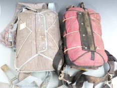 Two backpack type parachutes, one dated 1987