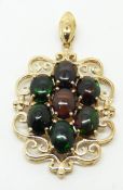 A 9ct gold pendant set with seven oval cut Mezezo opals, 5.3g