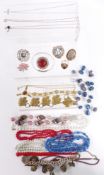 A collection of jewellery including Charles Horner silver bangle, Miracle brooch etc