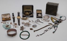 A collection of costume jewellery including silver bangle, silver, vintage and filigree brooches,