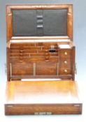 Oak travelling writing slope stationery box, the fold out slope opening to reveal fitted interior