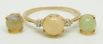 A 9ct gold ring set with a round Ethiopian opal cabochon and two diamonds with similar earrings, 2.