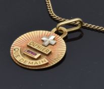 An 18ct gold pendant set with two rubies and engraved 'I love you more today than I did yesterday