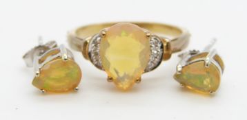 A 9ct gold ring set with a pear cut Indonesian opal and diamonds (size N) and a pair of 9ct white