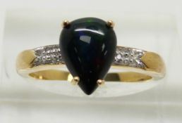 A 9ct gold ring set with a pear cut Mezezo cut opal cabochon and diamonds, 2.7g, size N