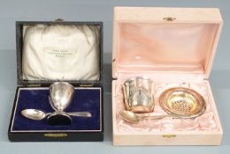 Cased hallmarked silver eggcup and spoon set together with a cased silver plated tea or similar set