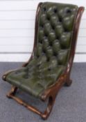 Leather Chesterfield style button backed nursing chair with shaped mahogany frame