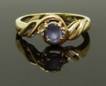 A 14ct gold ring set with a tanzanite and diamonds, size L, 1.89g
