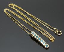 A 9ct gold pendant set with blue diamonds on a 9ct gold chain, 1.6g