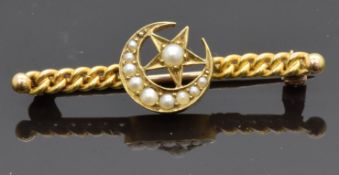 Edwardian 15ct gold brooch set with seed pearls in a crescent and star design, 2.7g