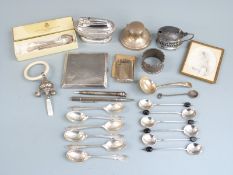 Hallmarked silver items to include cigarette case, two sets of six spoons, napkin ring, mustard with