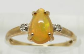 A 9ct gold ring set with a pear cut opal and diamonds, 1.9g, size N