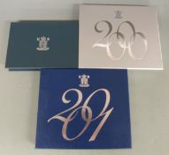 Three Royal Mint cased UK proof sets for the Millennium year 2000, 2001 and 1999, with certificates