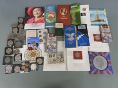 A collection of collectable UK coins, Royal Mint presentation packs and a quantity of modern crowns