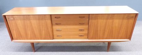 A retro mid century G-Plan style sideboard with two sliding doors either side of four drawers,
