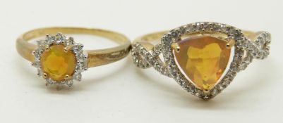 Two 9ct gold rings set with an Indonesian trilliant cut opal surrounded by zircons, and a 9ct gold