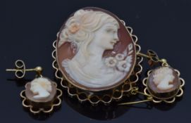 A 9ct gold brooch set with a cameo depicting a young woman (2.7 x 3.5cm) and a pair of 9ct gold