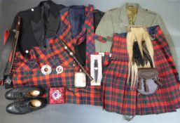 A large collection of Scottish national dress including plated sporran, kilts, tweed jacket,