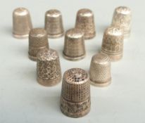 Seven hallmarked silver thimbles, another marked Sterling and two plated thimbles